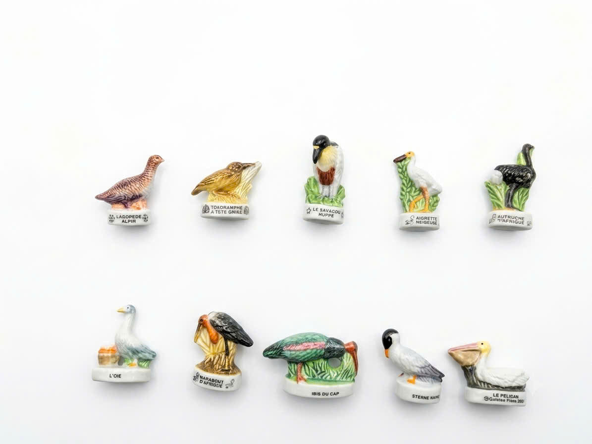 Exotic birds porcelain fève collection – 10 hand-painted miniature bird figurines including Pelican, African Ostrich, Snowy Egret and Marabou Stork