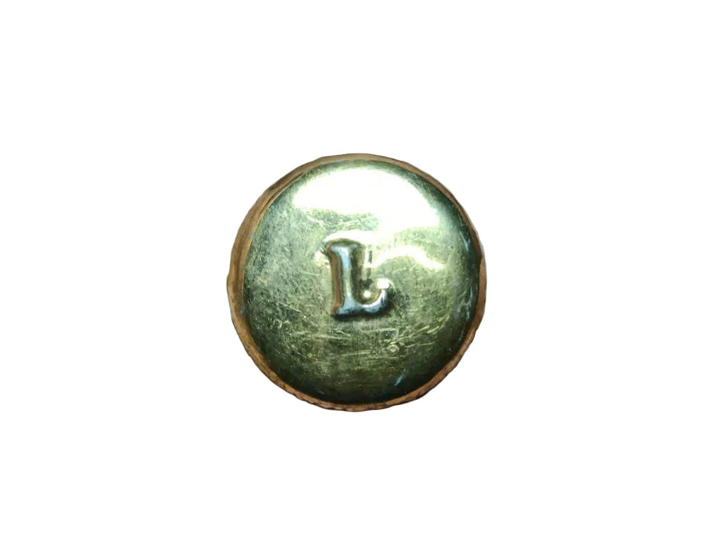 Vintage Ladurée Paris fève – silver-grey ceramic base with gold engraved lettering