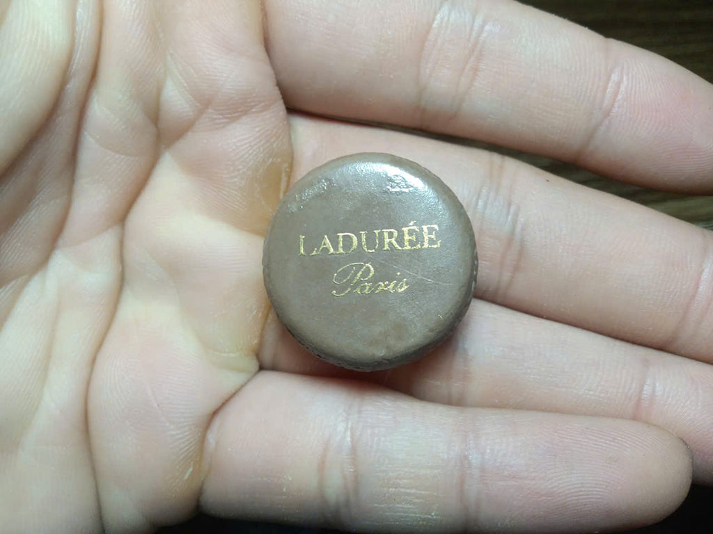Vintage Ladurée fève – gold-toned dome top with engraved L monogram